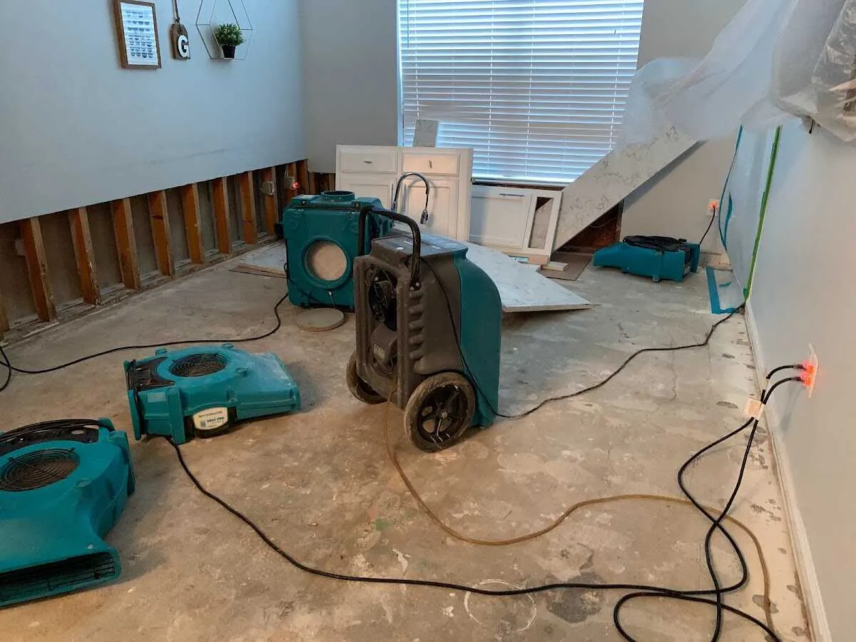 Dehumidifier in flood-cut room for Water Damage Restoration in Clarence